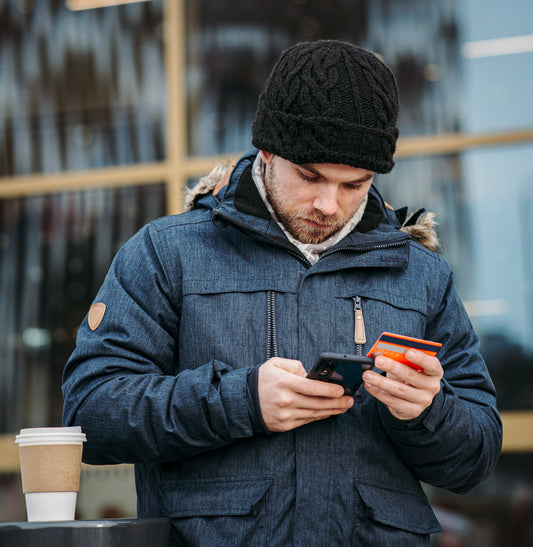 Man checking bank account after buying a coffee